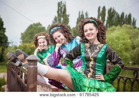 Three Young Beautiful Girls In Irish Dance Dress And Wig Posing