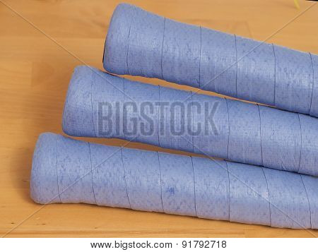 Freshly wrapped blue over grips on Tennis rackets