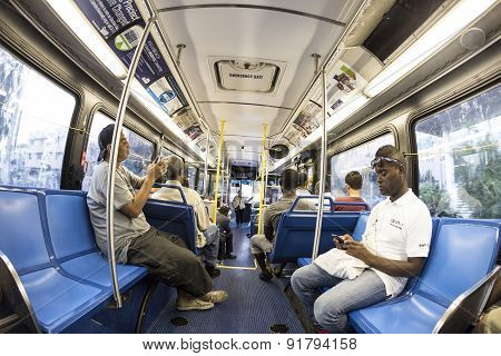 People In The Downtown Metro Bus In The Evening