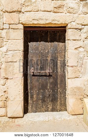 The old wooden door in the ancient nabatean town Shivta in the Negev desert, Israel