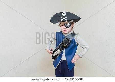 child boy playing pirate. Pirate costume on a child. The captain of a pirate ship.