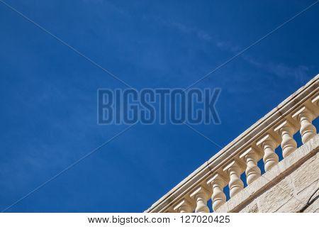 A terracce watching a blue summer sky