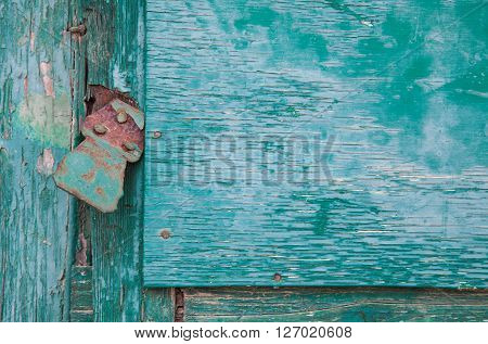 Grunge old wood panels ruined by weather with lock