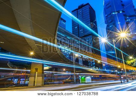 light trails through the footbridge,hongkong china.