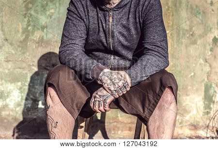 Man possing with tattoed hands, selective focus