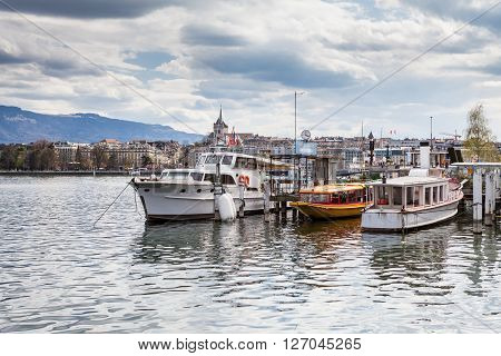 GENEVA, SWITZERLAND - APRIL 11, 2015: Exterior views of the buildings and fountain at the Geneva Lake on April 11 2015. Its the second most populous city in Switzerland (after Zurich).