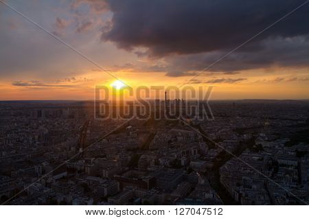 High view of Paris skyline France; from Montparnasse Tower with Eiffel Tower. In the background the skyscrappers of La Defense district.