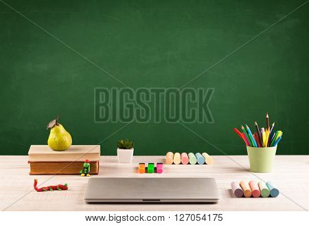 Back to school concepty with clear blackboard background, desk, items