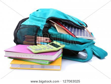 Backpack with school supplies, isolated on white