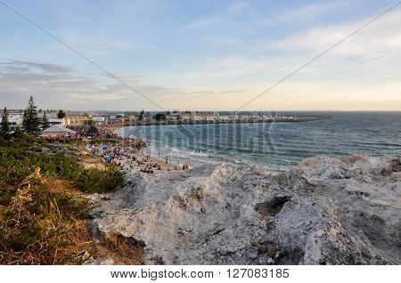 FREMANTLE,WA,AUSTRALIA: JANUARY 26,2016: Limestone overlooking Bather's Beach at twilight with people on Australia Day in Fremantle, Western Australia.