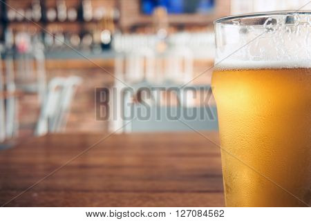 a glass of beer in a restaurant