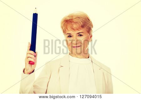 Smile elderly woman pointing up with hege pen
