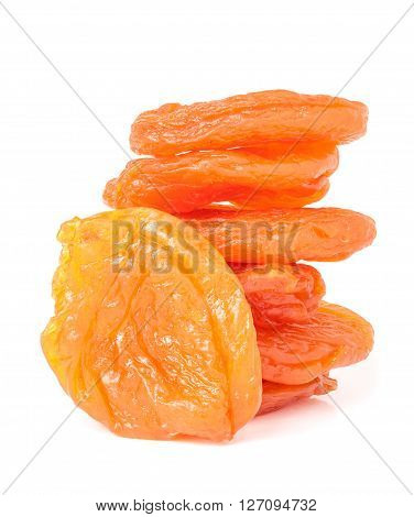 heap of dried apricots isolated on white background closeup.