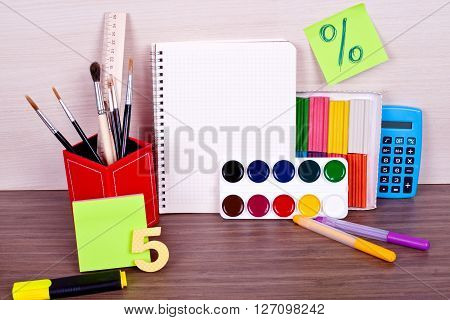A lot of bright new items for creativity on a wooden table