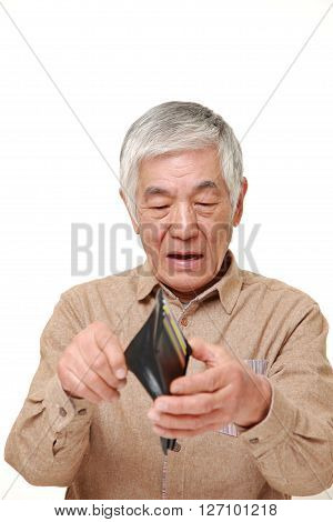 studio shot of poor senior Japanese man on white background