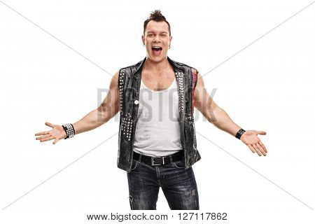 Cheerful punk rocker in an old jacket with pins and badges gesturing with his hands isolated on white background