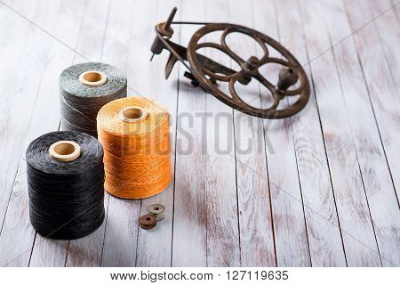 Set of sewing threads for shoes on a wooden background
