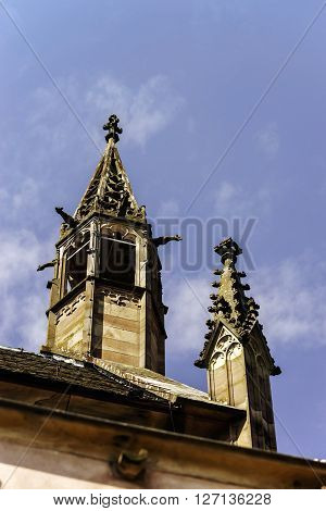 Gargoyle On A Gothic Cathedral, Detail Of A Tower On Blue Sky Background