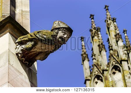 Gargoyle On A Gothic Cathedral, Detail Of A Tower On Blue Sky Background