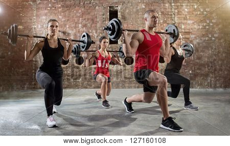 group of young people workout a exercise body pump