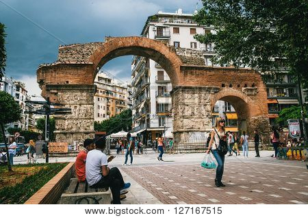 THESSALONIKI, GREECE - MAY 27, 2015: Woman walks on the background of The Arch of Galerius.