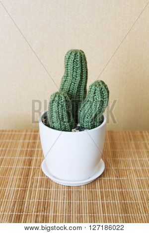 three knitted cactus handmade cushion for needles