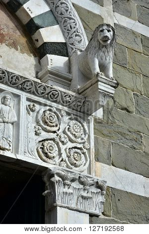 Detail form the beautiful portal of San Pietro Somaldi in Lucca with lion as guardian very common element in medieval and romanesque church in Italy