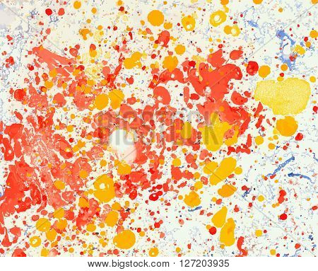 Scenic background from spots and stains of oil paint in red and yellow colors