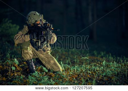 Soldier with Assault Rifle Night Time Military Operation.