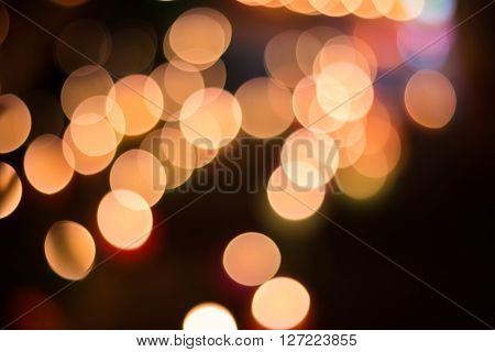 City light bokeh background urban street traffic at night colorful blur vehicle headlight circles