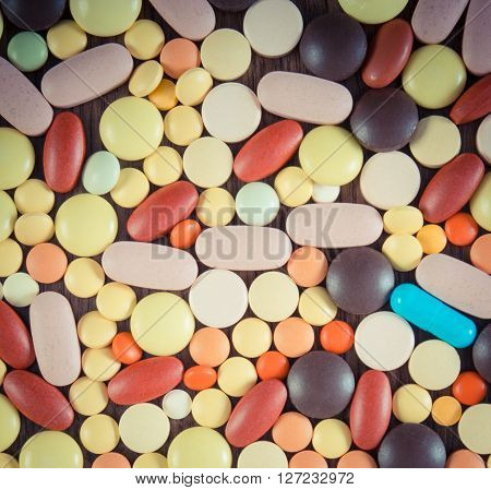 Vintage photo Heap of colorful medical pills capsules or supplements for therapy concept of treatment and health care