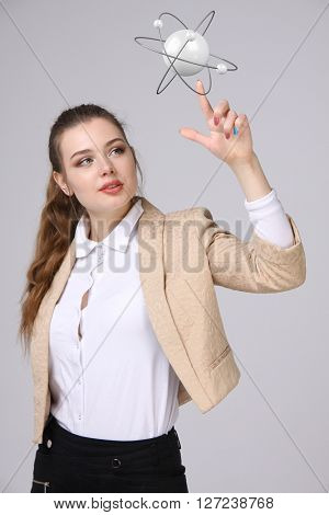 Woman scientist with atom model, research concept
