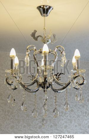 The big crystal chandelier in an ancient palace.