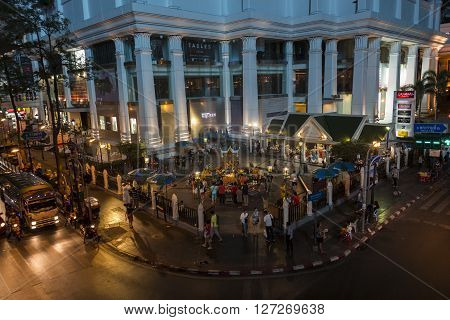 BANGKOKTHAILAND - JAN 23 : dusk scene of unidentified people worship in Erawan shrine at Ratchaprasong Junction on january 23 2016 Thailand.