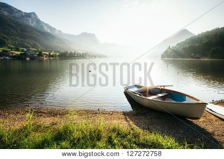 Fantastic views of the morning lake glowing by sunlight. Dramatic and picturesque scene. Location: resort Grundlsee, Liezen District of Styria, Austria, Alps. Europe. Beauty world. Instagram effect.