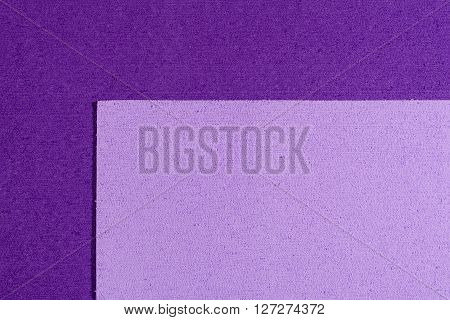 Eva foam ethylene vinyl acetate light purple surface on purple sponge plush background