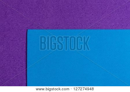 Eva foam ethylene vinyl acetate blue surface on purple sponge plush background