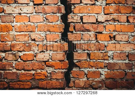 A brick wall with a crack red brick. A brick wall with a crack red brick