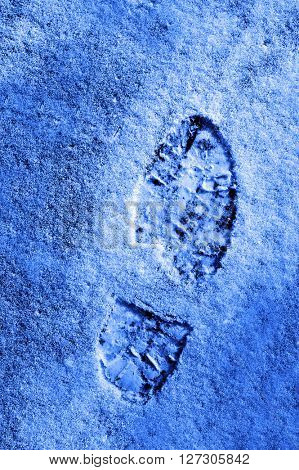 Footprint in the snow winter time treking hiking