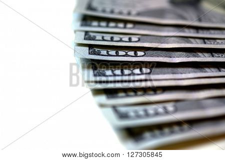 Closeup of hundred dollar bills money cash with corner of paper focussed