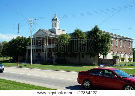PLAINFIELD, ILLINOIS / UNITED STATES - SEPTEMBER 20, 2015: The front of the Plainfield Village Hall in downtown Plainfield.