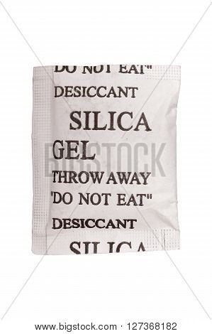 Close up silica gel or desiccant in paper bag on white background