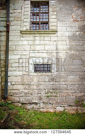 brick wall of old castle with window