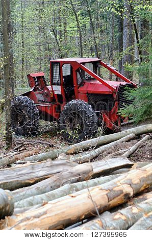 Cable skidder - heavy vehicle used in a logging operations for pulling cut trees out of a forest.