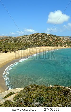 A creek in Crete with rocks island and of the greenery.