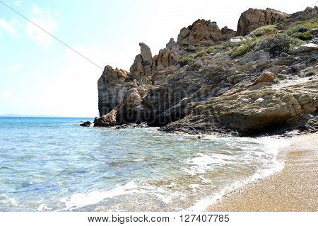 A beach in Crete with rocks and pebbles.