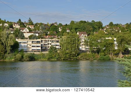 Triel sur Seine France - august 9 2015 : the picturesque city view from the left side of Seine river in summer