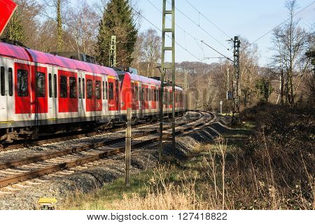 ESSEN KETTWIG NRW GERMANY - FEBRUAR 12 2016: Level crossing in Essen Kettwig an der Ruhr on Kattenturm. In driving railway train toward Duesseldorf.