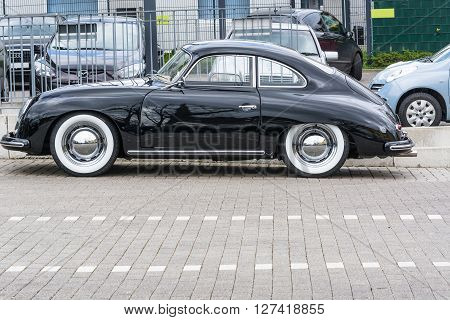 VELBERT NRW GERMANY - APRIL 06 2016: Black vintage Car 1600 with whitewall tires on a car park in Velbert city center Germany.
