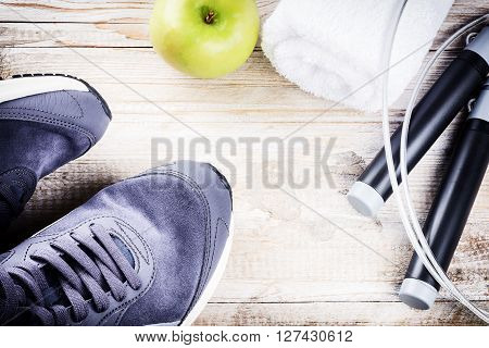 Fitness background with sneakers and skipping rope. Healthy lifestyle concept with copy space